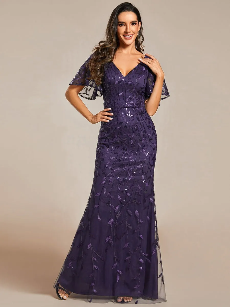 Eliza tulle sleeve black gown with gold leaf patterns Express NZ wide