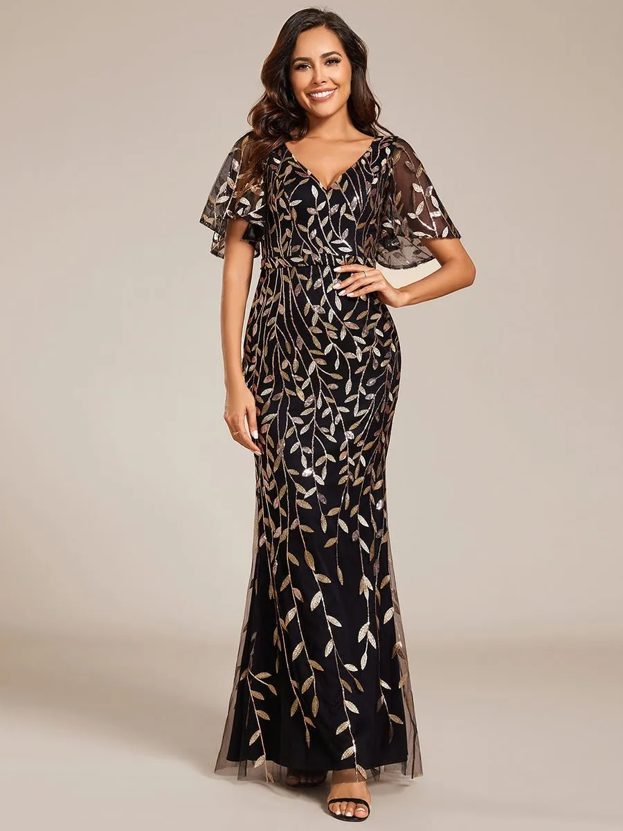 Eliza tulle sleeve black gown with gold leaf patterns Express NZ wide