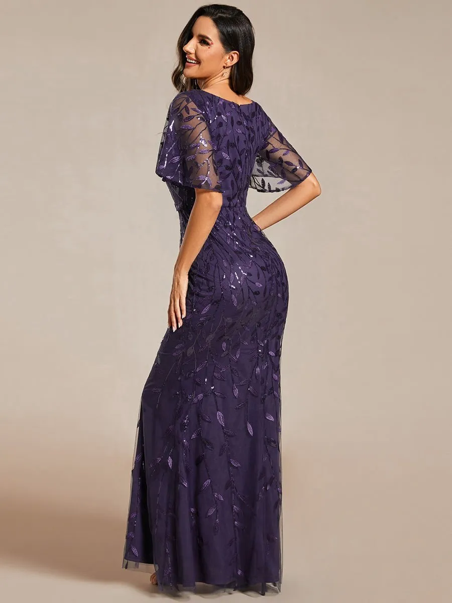 Eliza tulle sleeve black gown with gold leaf patterns Express NZ wide