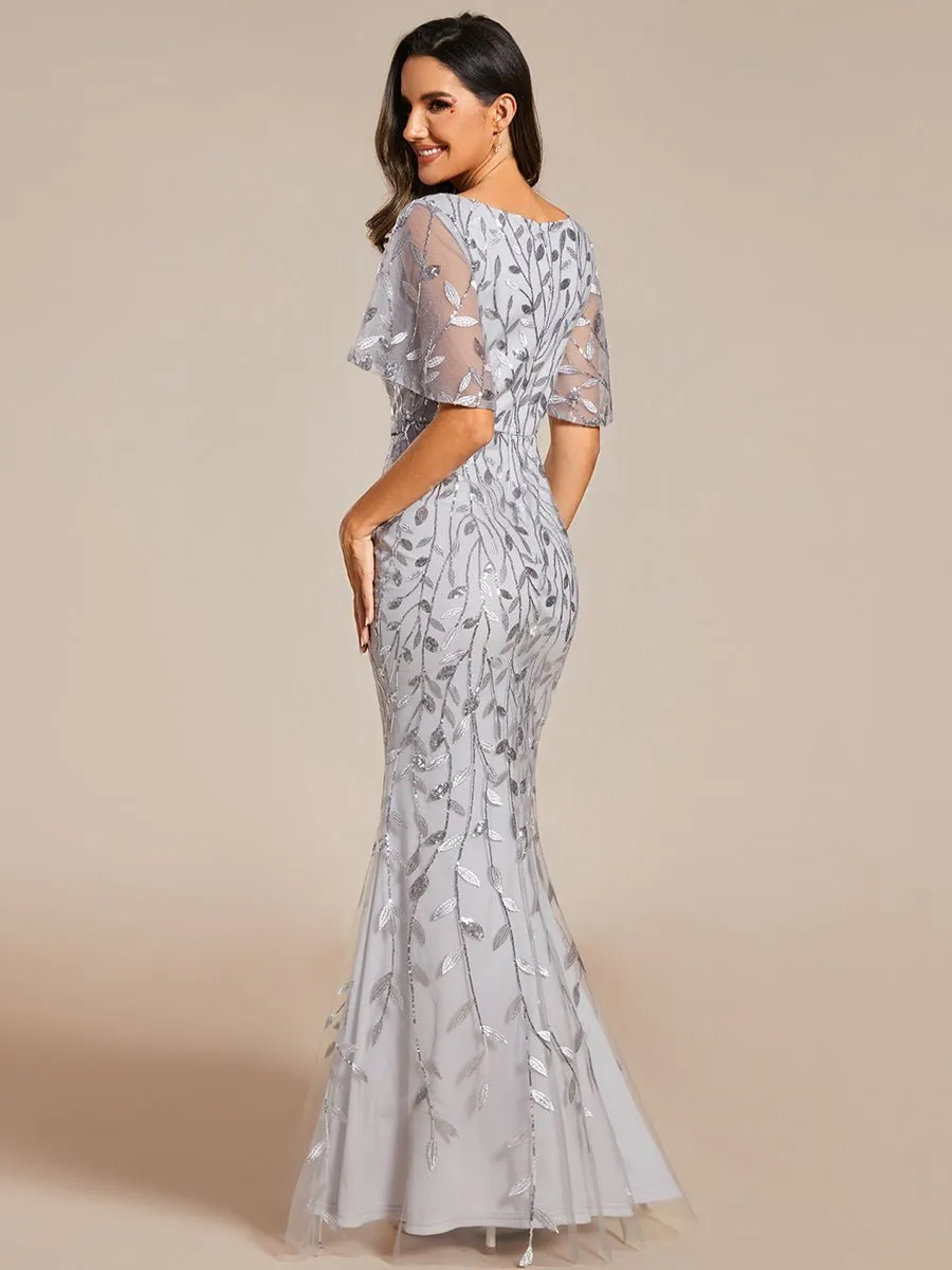 Eliza tulle sleeve black gown with gold leaf patterns Express NZ wide