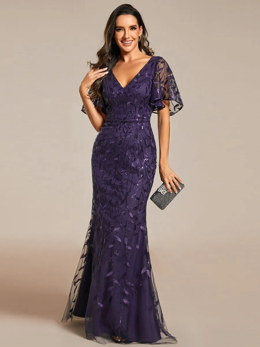 Eliza tulle sleeve black gown with gold leaf patterns Express NZ wide