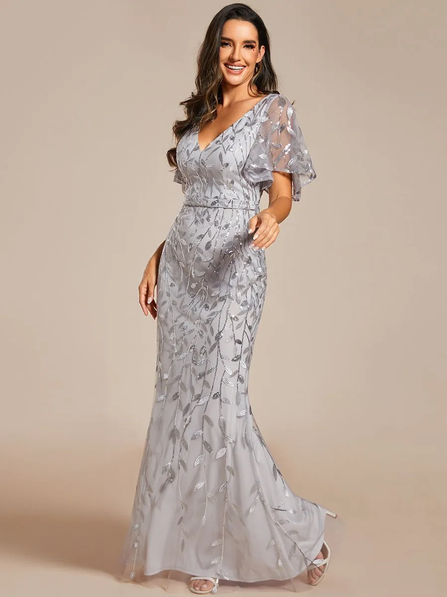 Eliza tulle sleeve black gown with gold leaf patterns Express NZ wide