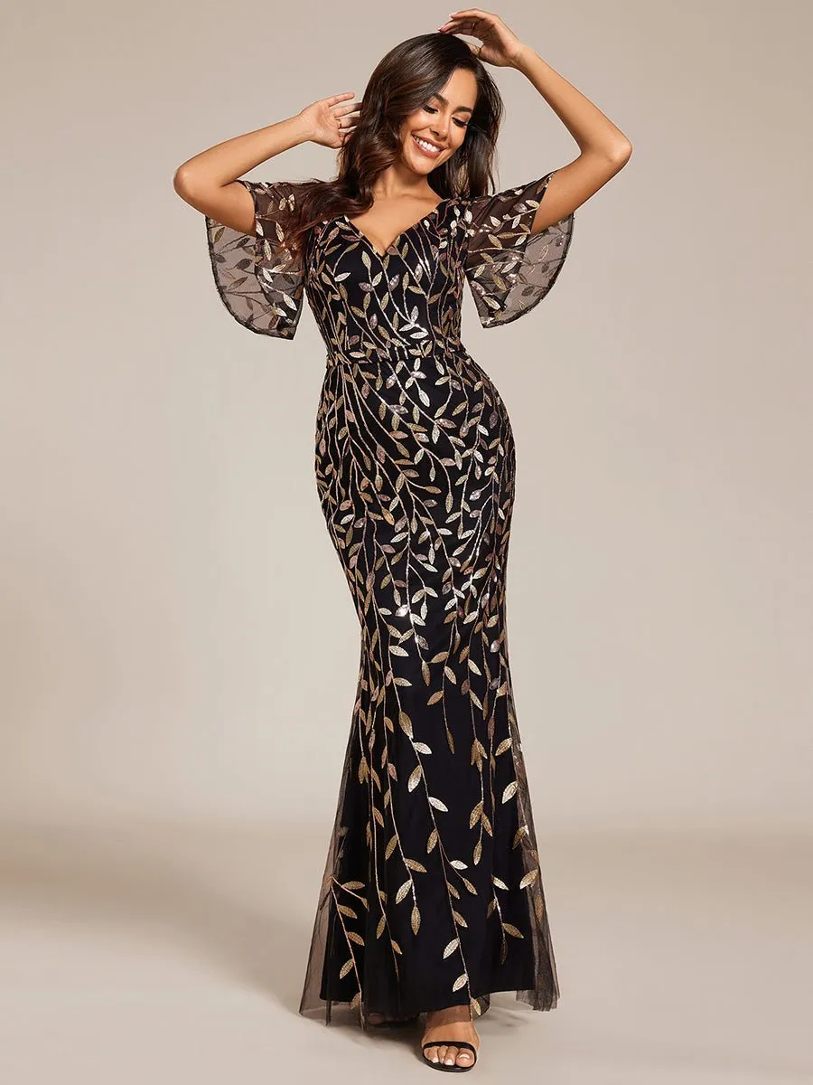 Eliza tulle sleeve black gown with gold leaf patterns Express NZ wide